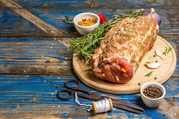 Raw pork roll stuffed with garlic and carrots