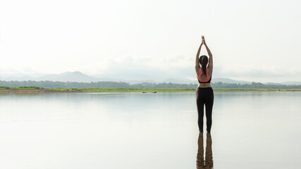 Yoga women lifestyle exercise and pose for healthy life. Young girl or people pose balance body vital zen and meditation for workout sunrise morning nature background.  copy space for banner