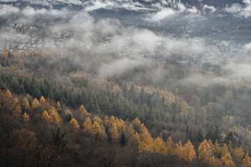 View of a small town among the mountains surrounded by mist