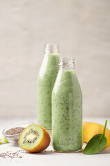 Diet drink smoothie of banana, kiwi, spinach and chia seeds. Vegan food.