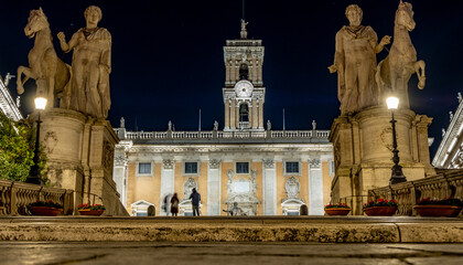 Fototapeta na wymiar Long exposure shot of people taking photos in front of the Campidoglio, a hilltop square with museums designed by Michelangelo.