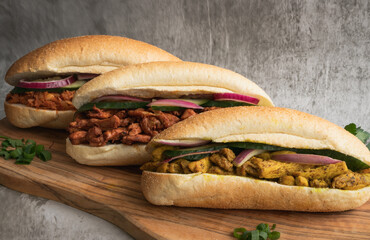 Indian Surinamese sandwiches filled with roti chicken curry,  cod fish or tandoori chicken  - obrazy, fototapety, plakaty