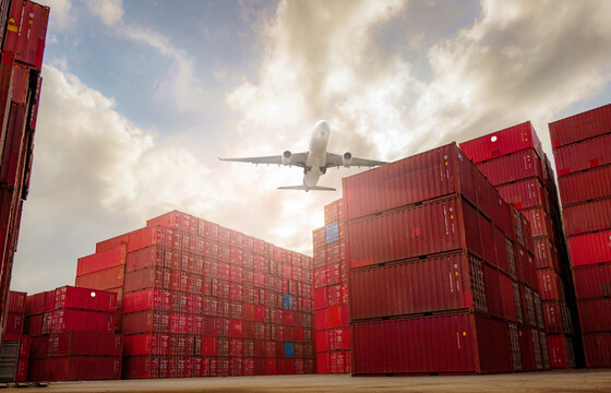Airplane flying above container logistic. Container crisis. Freight transportation. Logistic industry. Container ship for export logistics. Container at the harbor for truck transport. Air transport.