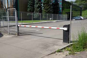 Orange closed parking barrier for cars