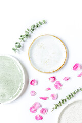 trendy woman desk with rose petals and plate top view mock-up