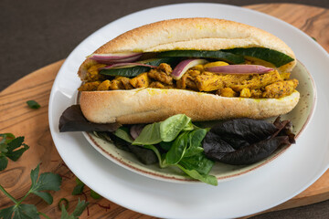 Indian Surinamese sandwiches filled with roti chicken curry,  cod fish or tandoori chicken 