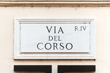 Obraz premium Via del Corso street sign on the main street of Rome, famous for shopping, Italy