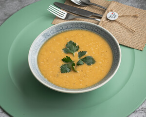 Dahl soup with yellow lentils on a table, lunch or dinning