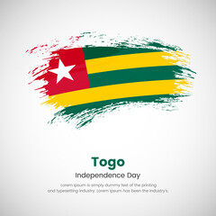 Brush painted grunge flag of Togo country. Independence day of Togo. Abstract creative painted grunge brush flag background.