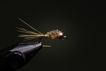 bead head orange wormfor trout fishing 