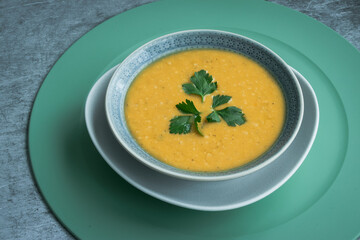 Dahl soup with yellow lentils on a table, lunch or dinning