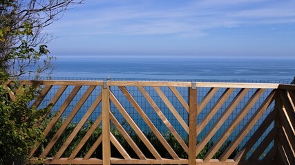 A breathtaking view of the Mediterranean sea from a balcony with a wooden railing (Pesaro, Italy, Europe)