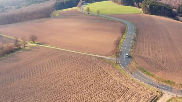 A White Van On A Country Road From Above