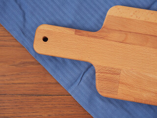 Cutting board or chopping board on wooden table. Wooden plate on desk. Top view