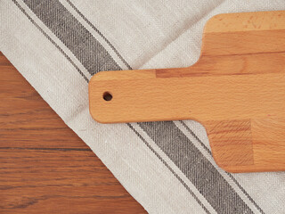 Cutting board or chopping board on wooden table. Wooden plate on desk. Top view