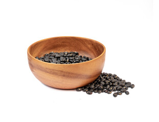 Black beans in wooden bowl on white background