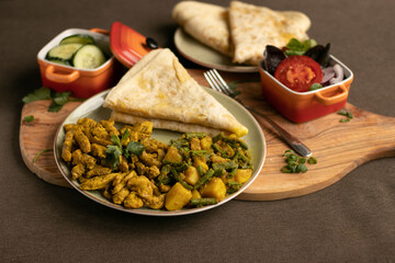 Indian-surinamese spicy food lunch and dinner, roti chicken curry