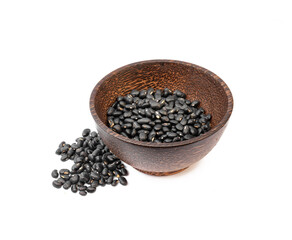 Black beans in wooden bowl on white background