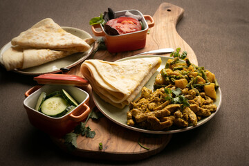 Indian-surinamese spicy food lunch and dinner, roti chicken curry