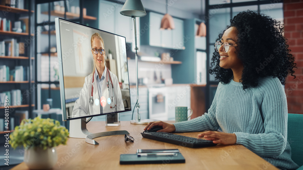 Aufkleber handsome latin female is making a video call to her medical consultant on desktop computer at home l