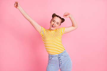 Photo of young happy excited funky smiling beautiful girl enjoying free time dancing isolated on pink color background