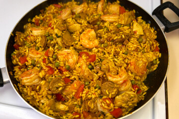 Seafood Paella. Pale Amanita Pantherinoides mushroom growing a lawn.

