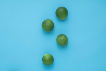 Natural fresh lime isolated on blue background