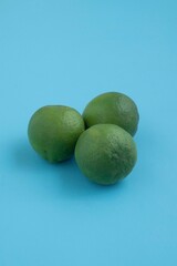Natural fresh lime isolated on blue background
