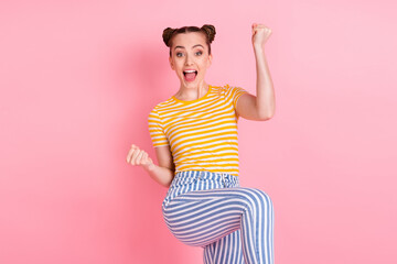 Photo of hooray nice brunette lady hands fists wear t-shirt pants isolated on pink background