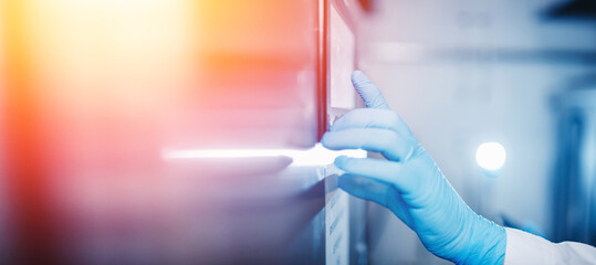 Concept control food industry. Factory worker inspecting production line tanker in of dairy with computer tablet