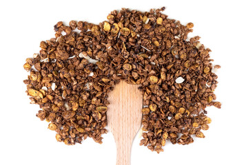Organic homemade roasted granola cereal with oats, flax, almonds, chocolate with wooden spatula isolated on white background. Top view muesli. Food hairstyle, fun concept
