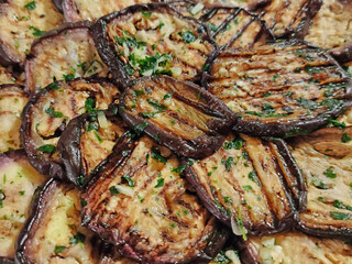 grilled and seasoned aubergines background