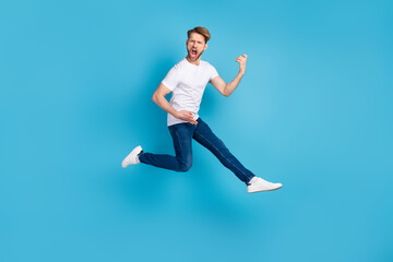 Fototapeta na wymiar Full body photo of young person open mouth shout loud hands play guitar isolated on blue color background