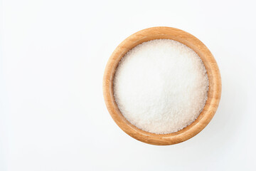Sugar cube in bamboo bowl isolated on white background. Top view.