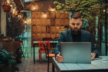 Businessman using a laptop in a cafe