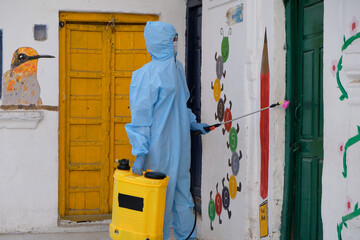 Indian sanitary worker conducting disinfection of the interior during the COVID-19 pandemic