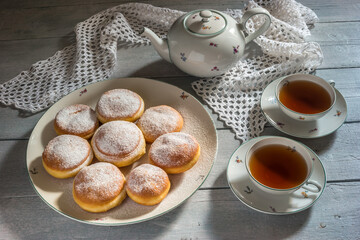 Traditional Czech donuts filled with jam served with tea