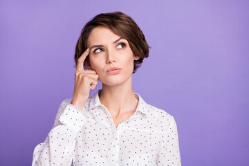 Portrait of attractive minded brown-haired girl manager overthinking brainstorming isolated over...