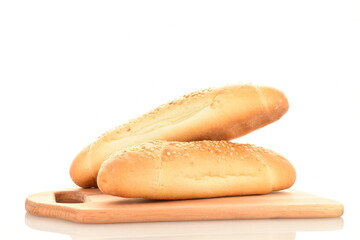 Two delicious fragrant bagels on a wooden board, close-up, isolated on white.