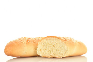 One whole and one half fragrant bagels sprinkled with sesame seeds in a black ceramic plate, close-up, isolated on white.