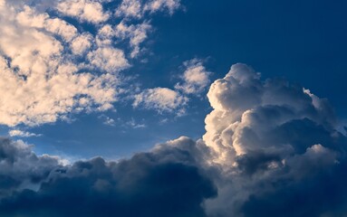 The blue sky with fluffy clouds
