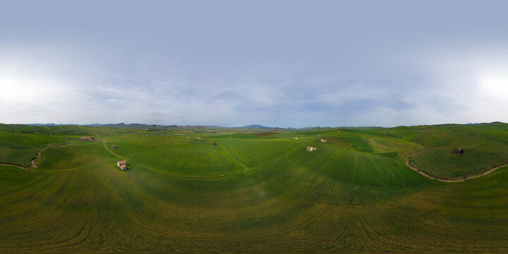 360 degree aerial photo of wheat fields with farms in the heart of Sicily. Etna view. Sicilian green wheat.