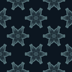 Seamless pattern of winter snowflakes. Good for backgrounds and prints. Vector