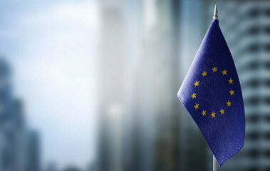 Small national flags of the European Union on a light blurry background