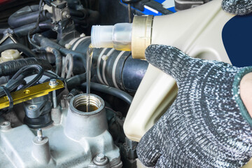 Close up of pouring new oil to old car engine, Car service.