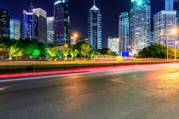 Architectural landscape and empty road at sunset in Shanghai, China