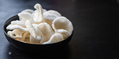tapioca chips flour or rice chips meal snack copy space food background rustic. top view keto or paleo diet vegan or vegetarian food