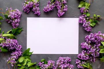 Frame of purple flowers - spring lilac branches with space for text
