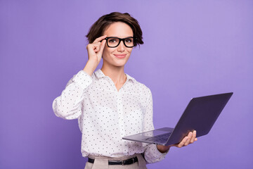 Portrait of nice brunette short hair optimistic lady type laptop wear spectacles white shirt isolated on lilac color background