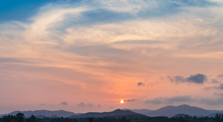 sunset sky over the mountains in evening 